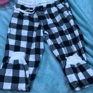 black and white plaid pajama pants with cuffs at the bottom